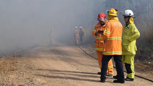 Midge Point Rural Fire Service brigade members set fire to scrub in a controlled burn on Wednesday August 5. generic, QFES, RFS, smoke. Picture: Zizi Averill