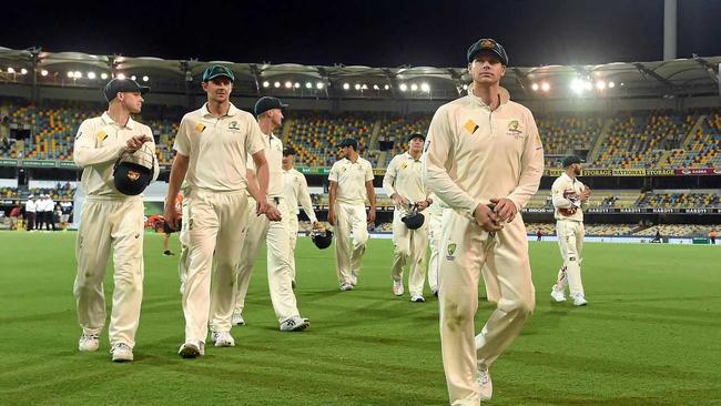 Australian captain Steve Smith leaves the field at stumps on day four at the Gabba. Picture: DAVE HUNT