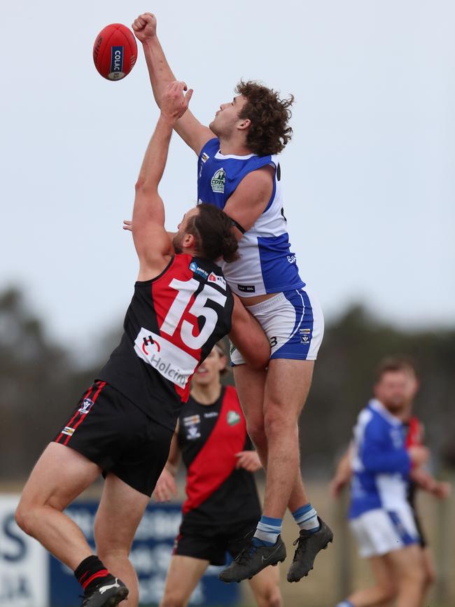 South Colac big man Tyler LoRicco soars over Irrewarra-Beac’s Haydn Slater.