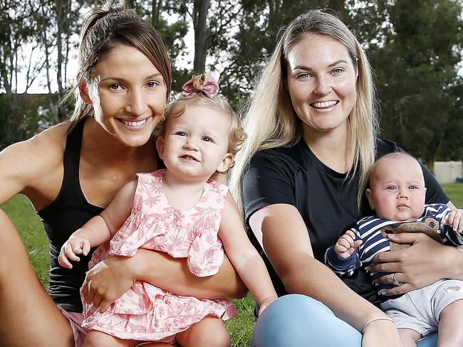 Queensland Firebirds players Kim Ravaillion and Georgie Treloar, 13 months with Gretel Bueta and Bobby Bueta, 3.5 months posing at Hawthorne, Brisbane 26th of April 2021.  They both had kids in the same year.  (Image/Josh Woning)