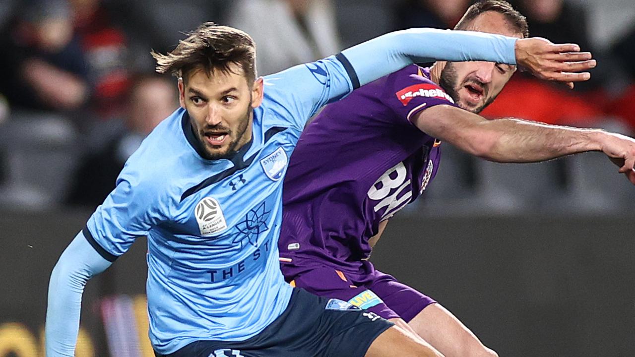 Milos Ninkovic challenged by Ivan Franjic during the A-League semi between Sydney FC and Perth Glory.