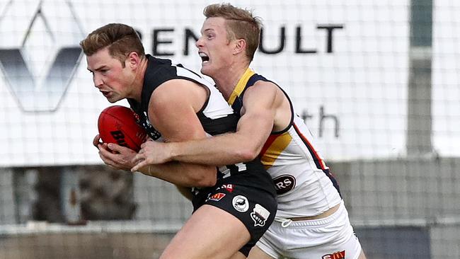 Brett Eddy and Alex Keath compete for Port and Crows in the SANFL last year. Picture: Sarah Reed