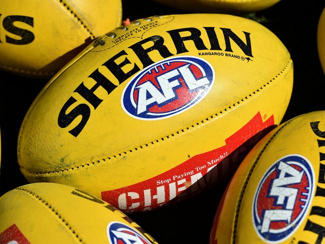 Australian Rules footballs are seen at Arden Street in Melbourne, Thursday, Sept. 10, 2015. (AAP Image/Julian Smith) NO ARCHIVING