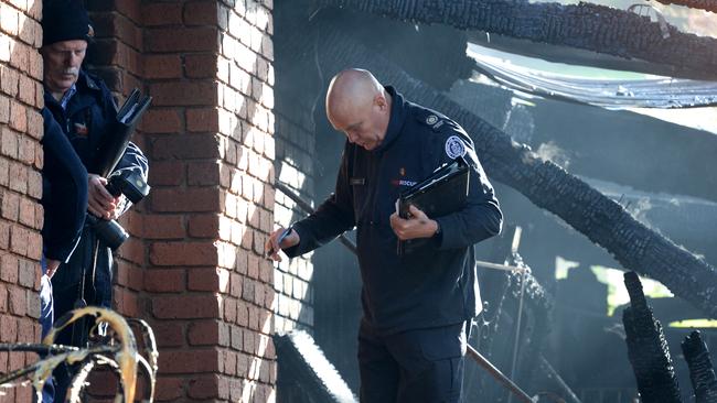 Police and fire investigators at the scene of the fatal Endeavour Hills house fire. Picture: Andrew Henshaw