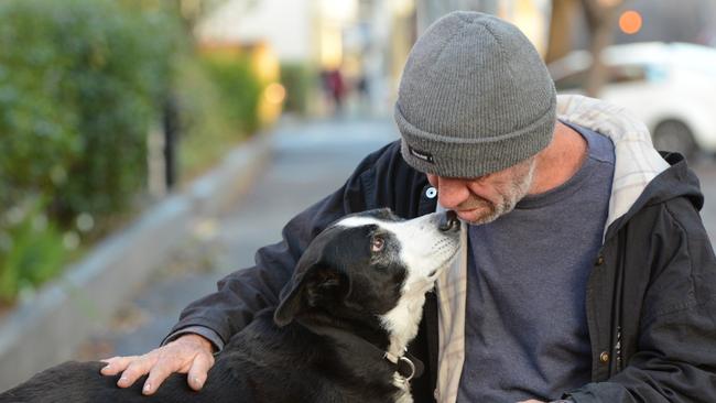 Brett Nicholls reunites with his dog Molly after she was found following a Facebook appeal. Picture: AAP Image/Brenton Edwards