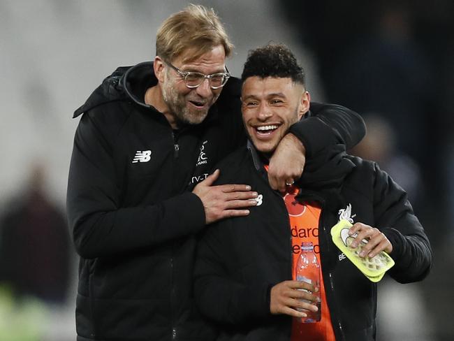 Klopp (L) hugs Liverpool's Alex Oxlade-Chamberlain.