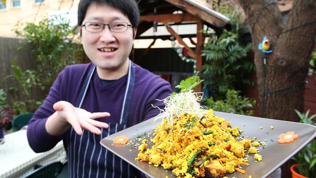 Bliss Organic Cafe’s Ray Wang with a serve of tofu scramble. Picture: Stephen Laffer