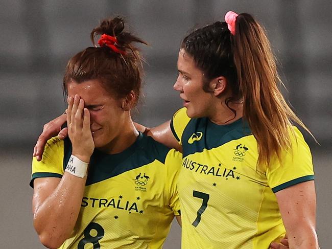 CHOFU, JAPAN - JULY 30:  Madison Ashby (L) and Charlotte Caslick (R) of Team Australia look dejected at full time in the WomenÃ¢â¬â¢s Quarter Final match between Team Fiji and Team Australia during the Rugby Sevens on day seven of the Tokyo 2020 Olympic Games at Tokyo Stadium on July 30, 2021 in Chofu, Tokyo, Japan. (Photo by Dan Mullan/Getty Images)