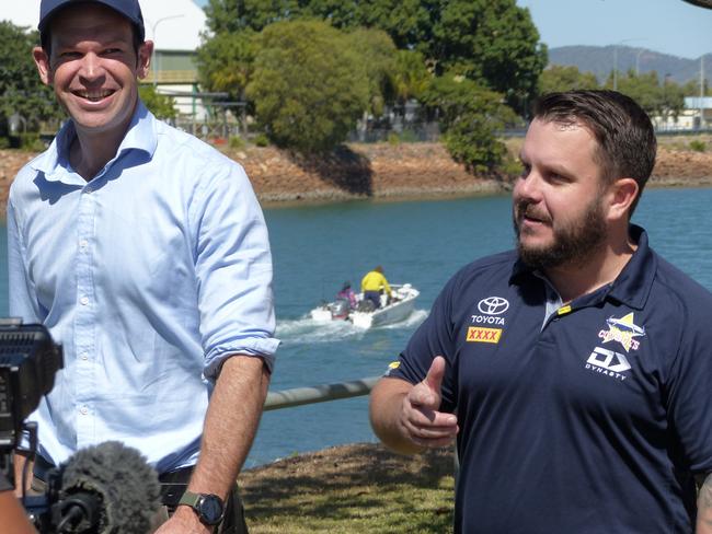 Queensland Nationals Senator Matt Canavan and Herbert MP Phil Thompson of the LNP discuss water projects in Townsville, while locals return from a morning’s fishing. Picture: Blair Jackson.