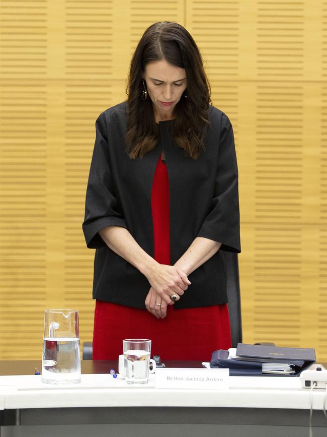 New Zealand Prime Minister Jacinda Ardern observes a minute’s silence on Monday. Picture: AP