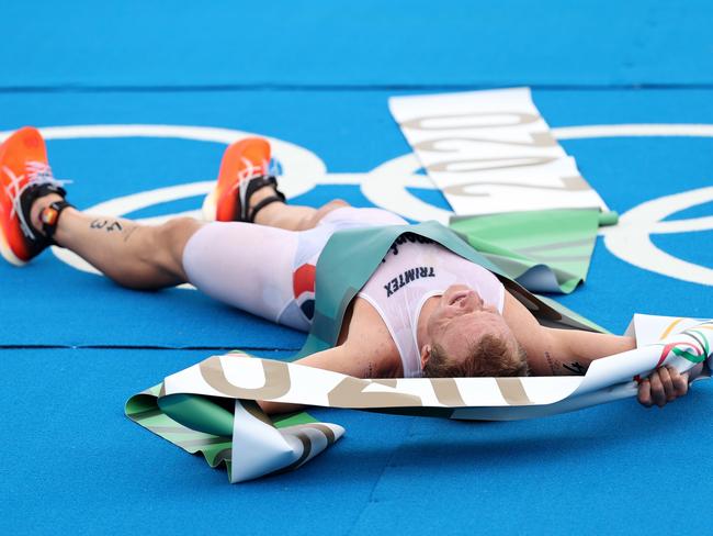 Men’s triathlon gold medallist, Norway’s Kristian Blummenfelt, was taken away in a wheelchair after collapsing and vomiting immediately after crossing the finishing line. Picture: Getty