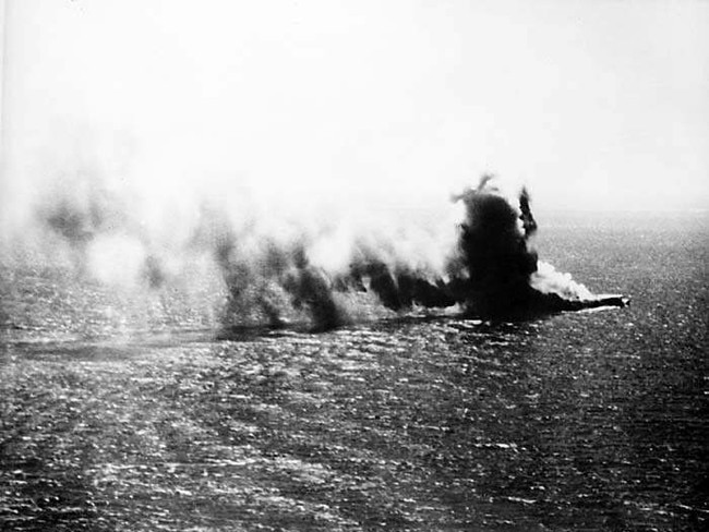 Smoke billows across the water in the final destruction of the Japanese carrier Shoho during the Battle of the Coral Sea in World War II. Picture: Australian War Memorial