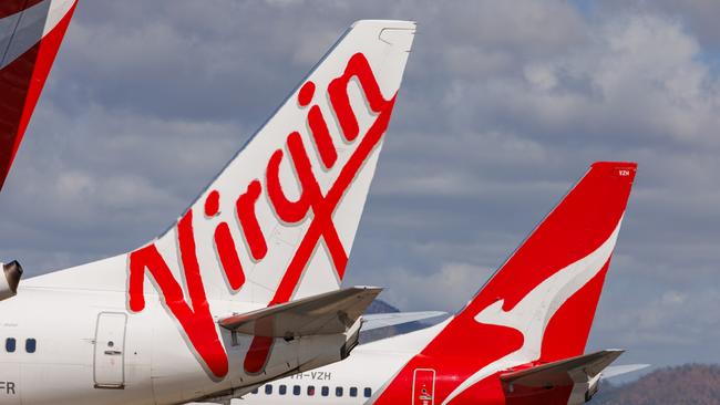 Townsville, Queensland - 28 July 2021: Virgin Australia and Qantas tails on display at Townsville Airport. 27 October 2024 Kendall Hill Photo - Getty Images