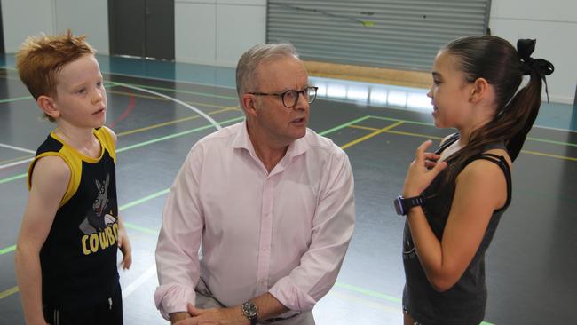 Redlynch siblings Connor Lucht, 7 and Milla Lucht, 11, talk about pickleball with Prime Minister Anthony Albanese at PCYC Cairns on Tuesday January 7, 2025. Picture: Samuel Davis