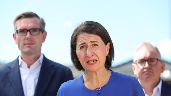 Premier Gladys Berejiklian, Treasurer Dominic Perrottet and Minister for Energy Don Harwin announce a major, new initiative that will help households reduce their energy bills at Casula, Sydney. Picture: Brett Costello