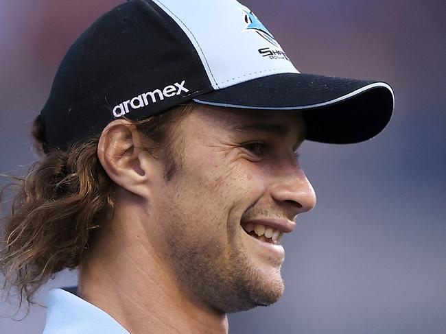 PENRITH, AUSTRALIA - MARCH 04: Injured Sharks player Nicho Hynes watches on during the warm-up before during the round one NRL match between Cronulla Sharks and South Sydney Rabbitohs at BlueBet Stadium on March 04, 2023 in Cronulla, Australia. (Photo by Mark Kolbe/Getty Images)