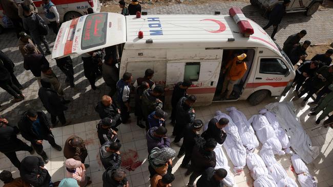 Palestinians recite a prayer over the bodies of victims of Israeli air strikes in the northern Gaza Strip, in front of the Indonesian Hospital in Beit Lahia on March 20. Picture: Bashar Taleb/AFP