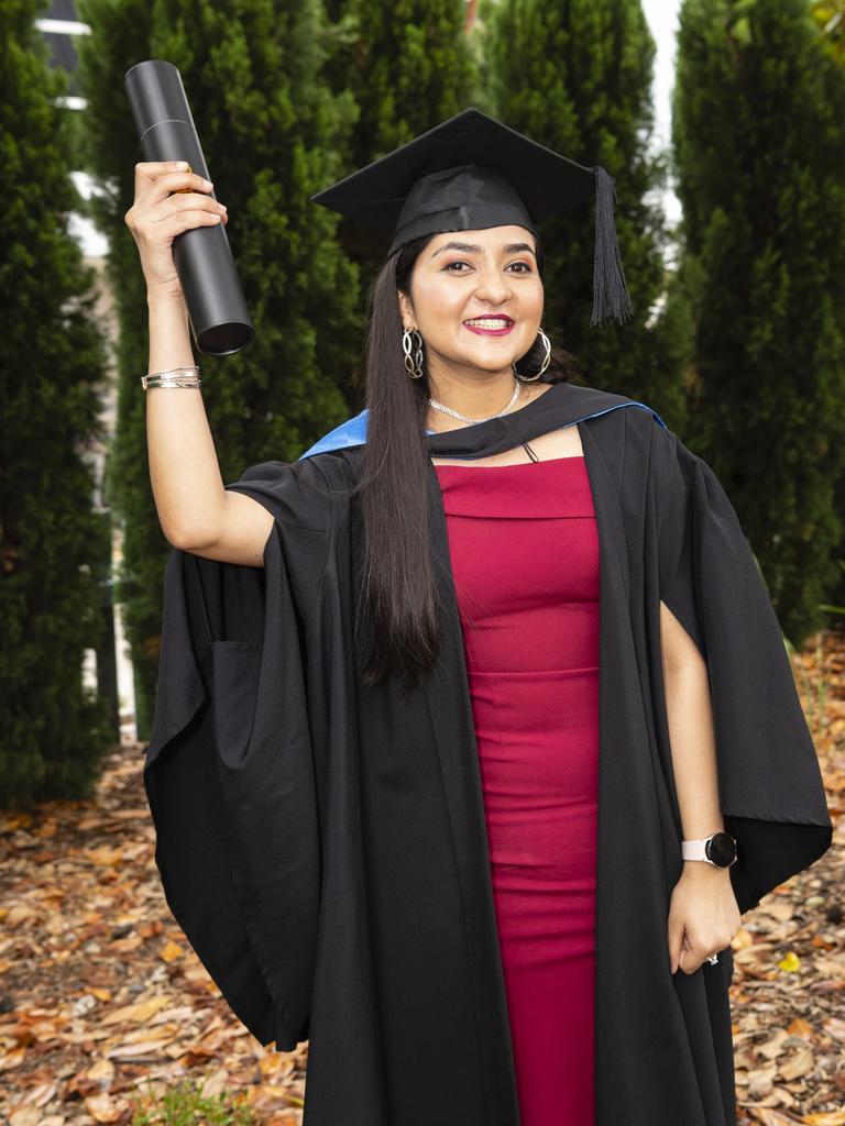 Yupika Gautam celebrates finishing her Bachelor of Nursing at the UniSQ graduation ceremony at Empire Theatres, Tuesday, December 13, 2022. Picture: Kevin Farmer