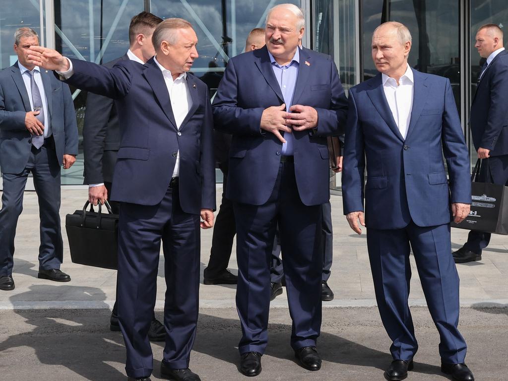 Russia's President Vladimir Putin (C) and Belarus' President Alexander Lukashenko (C-L) meet with Governor of Saint Petersburg Alexander Beglov (L). Picture: AFP