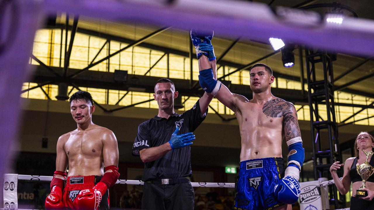 Aaron Phan (red) fights as Shaun Rundle (blue) takes on the wins at the NT Fight Series XI at Ventia Stadium. Picture: Pema Tamang Pakhrin