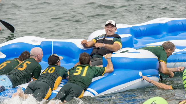 Former Wallaby and spinal injury victim Richard Tombs (middle) during the annual Manly Inflatable Boat Race at Shelly Beach. (AAP IMAGE / Troy Snook)