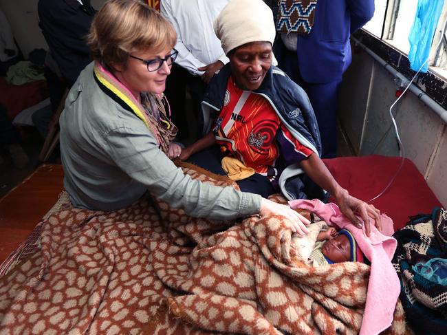 Defence Minister Linda Reynolds chats with Esta, the mother of one-month-old Mutina. Picture: Gary Ramage