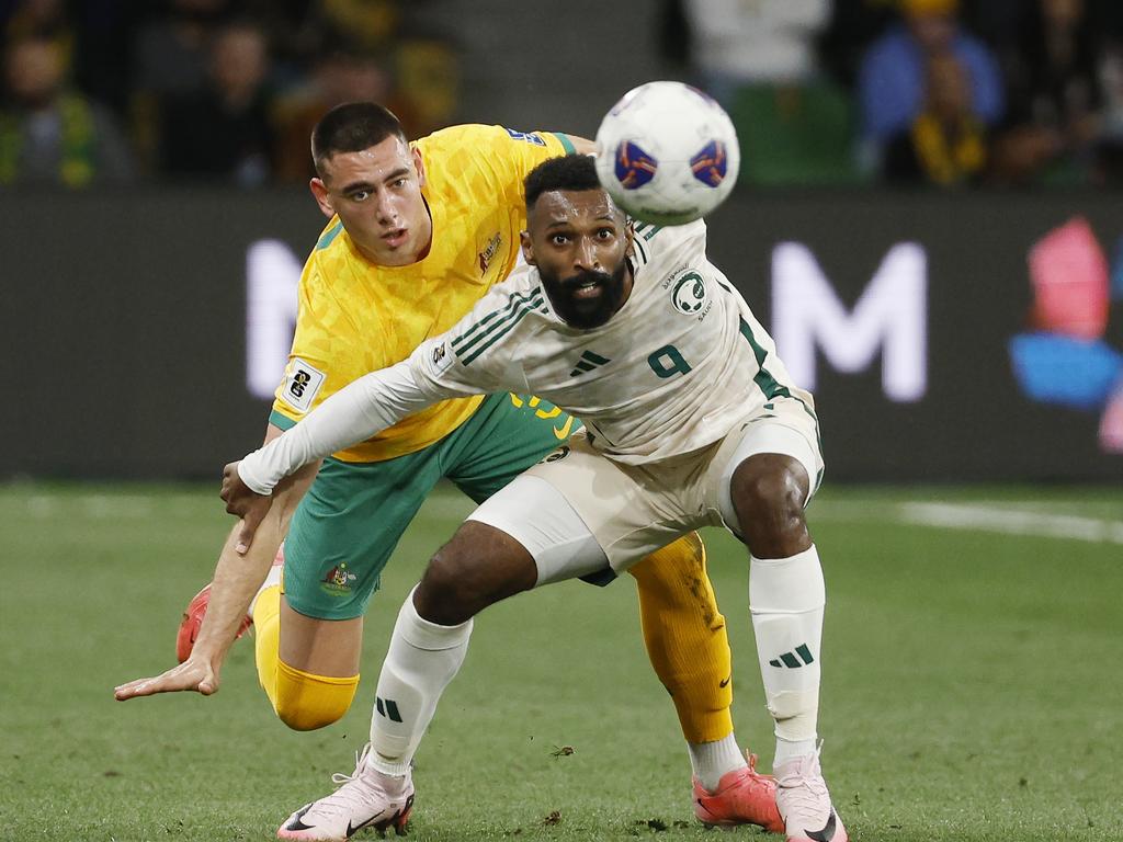 Saudi Arabia’s Feras Albrikan and Lewis Miller of the Socceroos battle for position 1st half . Picture: Michael Klein