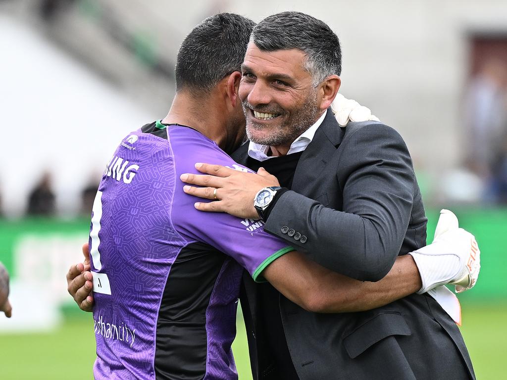 Jamie Young (left) embraces his then Western United coach John Aloisi. Picture: Steve Bell/Getty Images