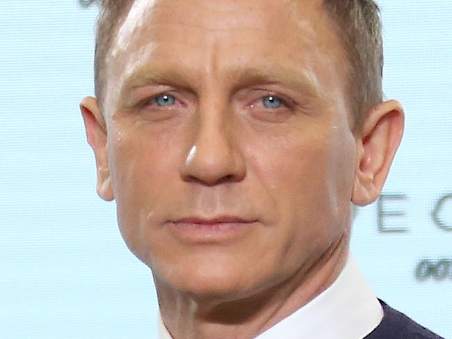 Actor Daniel Craig poses for photographers at the announcement for the new Bond film, the 24th in the series, at Pinewood Studios in west London, Thursday, Dec. 4, 2014. The titile of the new Bond production is Spectre. (Photo by Joel Ryan/Invision/AP)