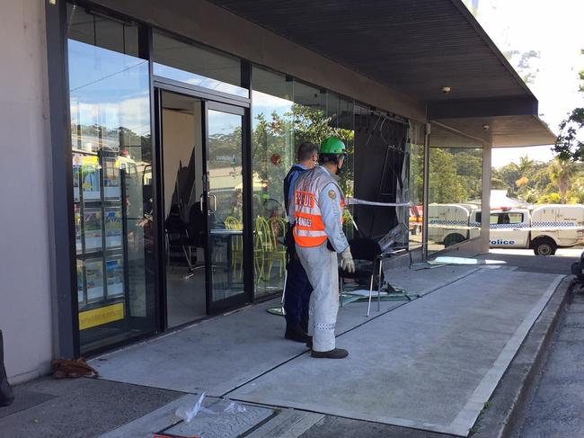 Police and rescue crews at the Ray White office. Picture: Richard Noone.