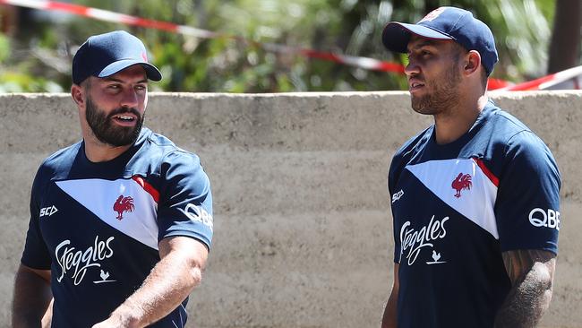 Tedesco walks to a closed training session alongside Blake Ferguson on Monday.