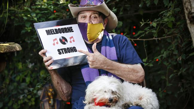 Music legend Molly Meldrum and his dog Ziggy urge Victorians to stay strong. Picture: David Caird