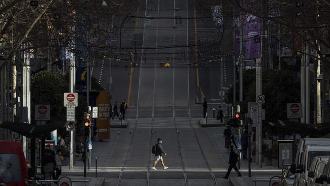 A view down eerily quiet Bourke Street in Melbourne, under draconian Stage 4 coronavirus restrictions. Picture: Daniel Pockett