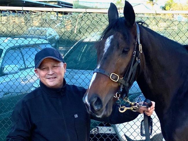 Trainer Greg Lee with Notabadharada, which won at $201 on the Kensington track at Randwick. Supplied