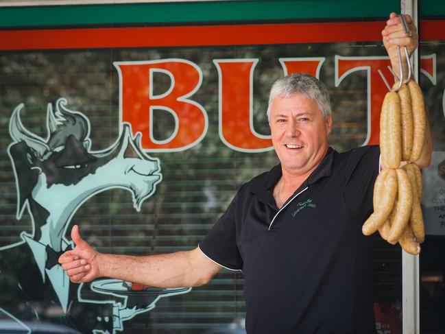 Former Fannie Bay Gourmet Meats owner Terry Wilkins with his award-winning chicken laksa snags. Picture: Glenn Campbell.