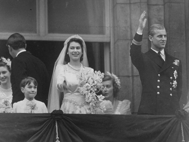 Princess Elizabeth and Prince Philip on the balcony at Buckingham Palace after their wedding in November, 1947. Picture: Central Press/Getty Images