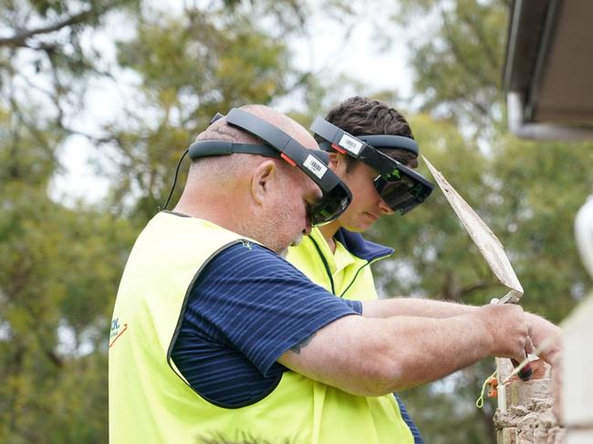 Fologram All Brick training includes bricklayers wearing VR headsets to follow the holographic images of where the bricks should be laid with accelerated speed and accuracy. Picture: supplied