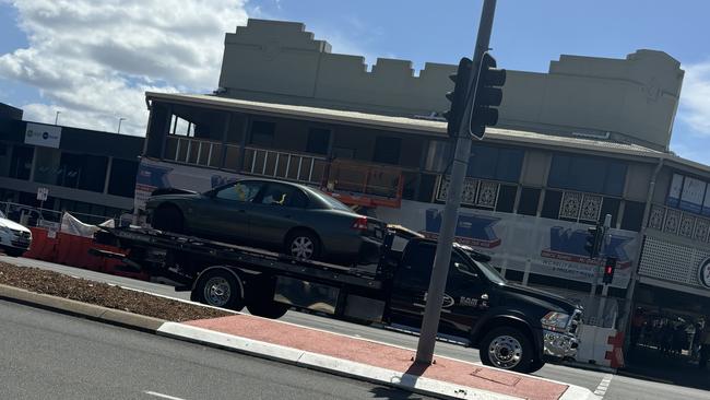 A silver SUV was left on its roof after a three car collision at the corner of Spence and Grafton Street in the Cairns CBD. Photo: Dylan Nicholson