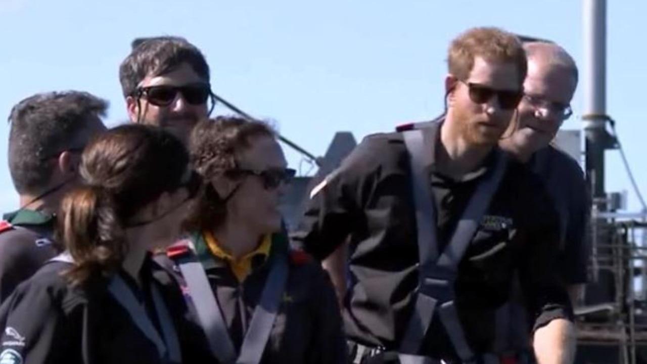 Scott Morrison seemed particularly keen to be in the photo with Harry on top of the Sydney Harbour Bridge but almost risked being obscured.