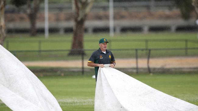 GCA1: South Barwon v Grovedale. Covers come on for a rain break after the first 2 overs. Picture: Mike Dugdale