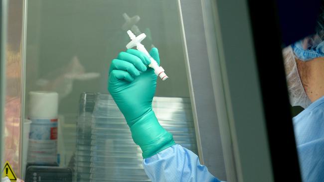 A laboratory worker at the industrial platform of YposKesi , the first French industrial pharmaceutical company producing gene and cell therapy drugs for rare diseases. AFP PHOTO / ERIC PIERMONT