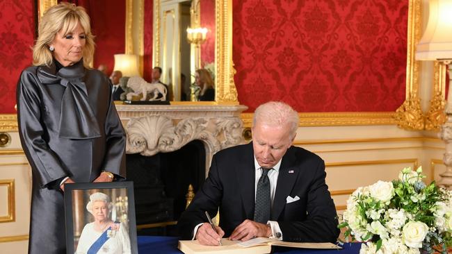 Joe Biden and wife Jill sign a book of condolence at Lancaster House in London. Picture: Getty Images