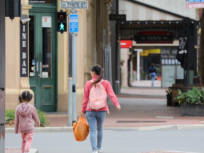 A woman and girl cross Tynte St, off O’Connell St in North Adelaide. Image/Russell Millard