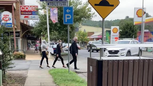 Sisters Lara Buttriss (a white blonde with scarf covering her hair) and Grace Buttriss (brunette) near Picton court with their lawyer. Picture: Adelaide Lang