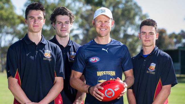 Western Jets coach Ryan O’Keefe with Maribyrnong Sports Academy students Owen King, Josh Honey and Billy Cootee. Picture: Sarah Matray