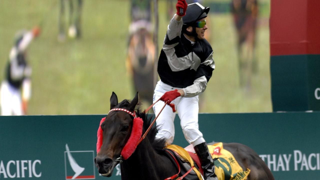 Sha Tin Races, Hong Kong. Race 5 Australian jockey Brett Prebblelooks behind him to see where the rest of the field is as he crosses the line and wins on Absolute Champion, trained by Australian David Hall in the The Cathay Pacific Hong Kong Sprint