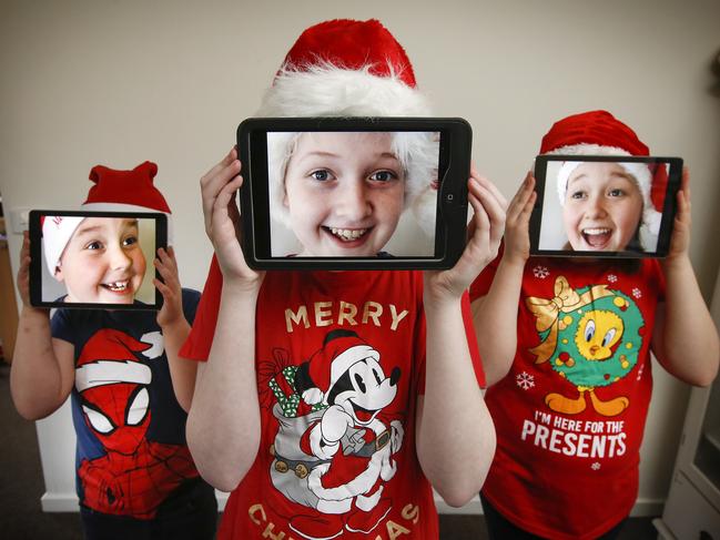 A couple of Melbourne councils are preparing to livestream their carols with no-one sure what COVID restrictions will be in place by December. Siblings Tyler 6, Tahlia 13 and Keira, 11 looking forward to singing carols on line.  Picture: David Caird