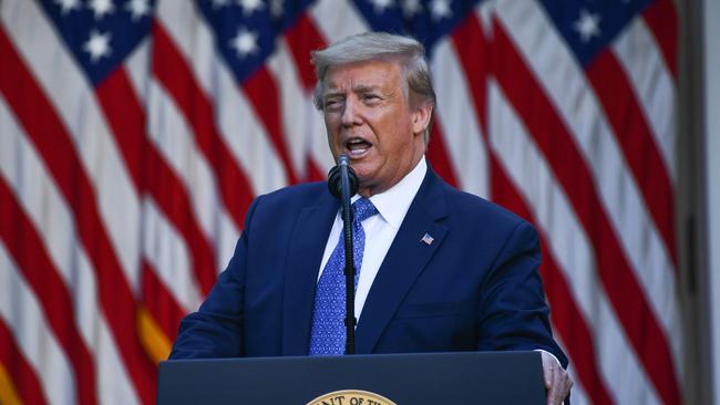 US President Donald Trump delivers remarks in front of the media in the Rose Garden of the White House in Washington.