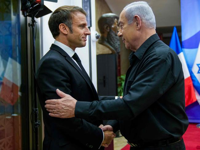 Israeli Prime Minister Benjamin Netanyahu greets French President Emmanuel Macron (left) before a meeting in Jerusalem on October 24, 2023. Picture: AFP