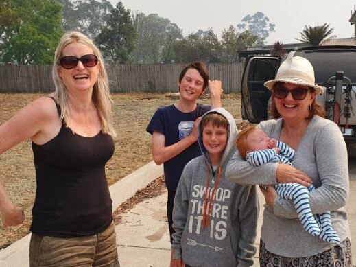 At a pit stop, a woman ran up to Annette Sharp (right) and asked to hold her baby while she killed a huntsman spider.